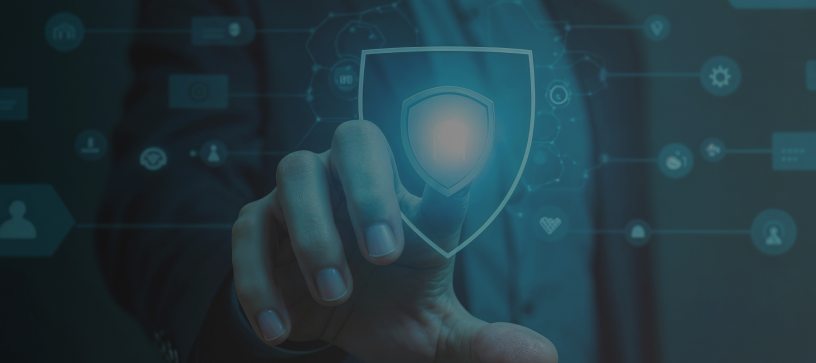 Cybersecurity Shield Interface – Hero Banner for Digital Protection Business professional touching a glowing shield icon on a cybersecurity interface, representing data protection and digital defense